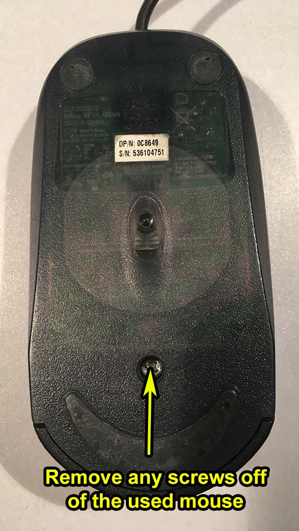 Remove the screws from the old mouse.