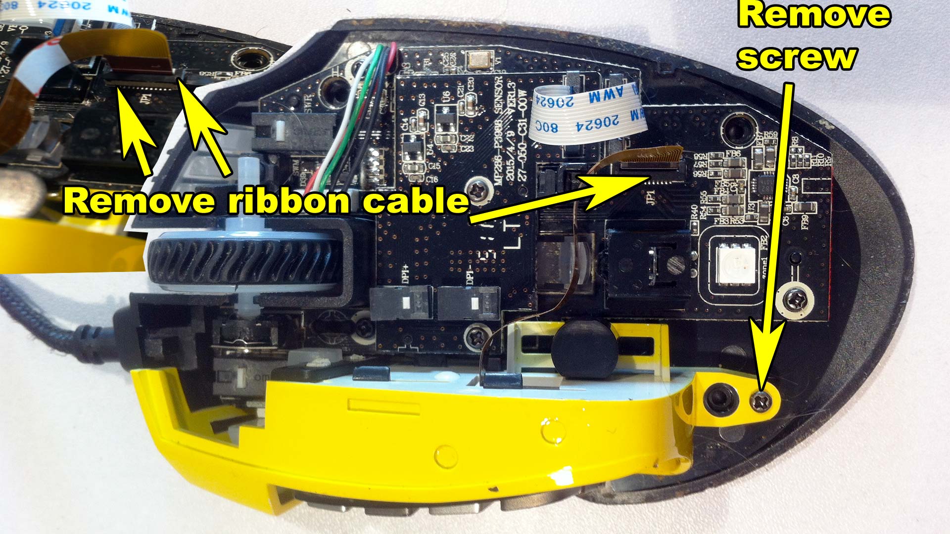 Corsair Scimitar - Remove ribbon cable and screw holding number pad in place.